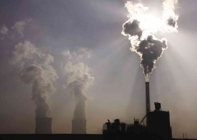 A coal-burning power plant releases huge amounts of carbon dioxide into the atmosphere in the city of Baotou, in China’s Inner Mongolia Autonomous Region. Scientists at University of California, Irvine, and Princeton University estimate that existing power plants around the world will spew out more than 300 billion more tons of carbon dioxide over their lifetimes .REUTERS/WWW.NATUREWORLDNEWS.COM 
