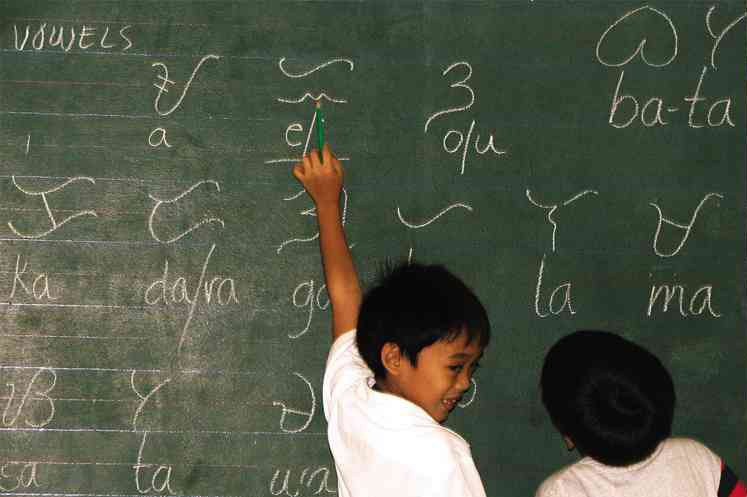  ‘ALIBATA’ Writing “alibata” or “baybayin” (a prehispanic script) amuses two Grade 1 students at St. John’s School in Malaybalay City during its Arts Week that promotes indigenous culture.  GRACE CANTAL-ALBASIN/INQUIRER MINDANAO 