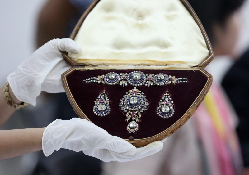 November 27, 2015 An official from the Presidential Commission on Good Government (PCGG) shows a tiara, seized froma a set of jewellery collection of former first lady Imelda Marcos, at the Bangko Sentral ng Pilipinas. Philippine authorities had the dazzling collection appraised by auction houses for a second day, ahead of a possible sale.  INQUIRER/ MARIANNE BERMUDEZ