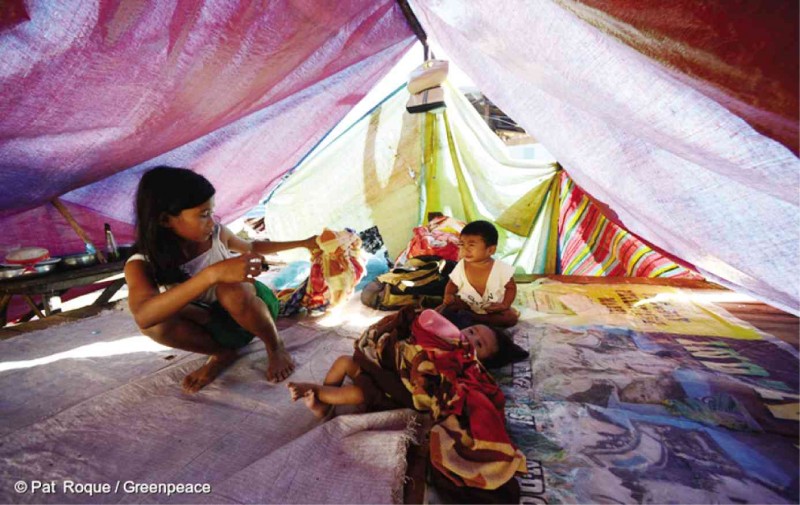 TYPHOON SURVIVORS  The devastation wrought by Typhoon “Pablo” (international name: Bopha) in 2012 forced these children to live in evacuation tents in Davao Oriental province. 