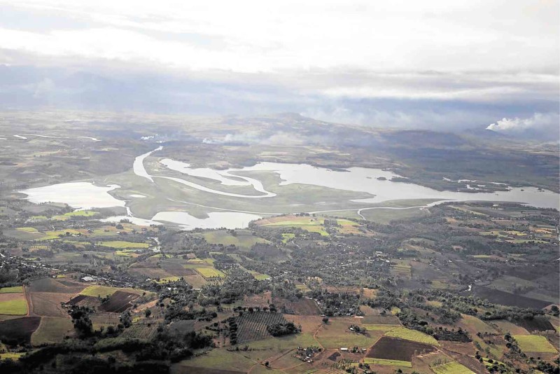 LAND emerges in the middle of the Pulangi Lake in Bukidnon as its shorelines recede amid the dry spell.  CONTRIBUTED PHOTO