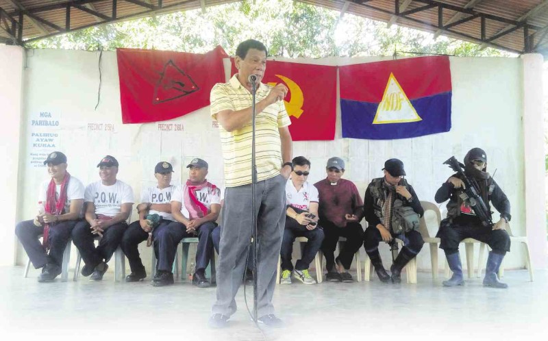 RELEASE OF POWS Five police officers captured by the New People’s Army in Paquibato, Davao City on April 16 were turned over to Davao City Mayor Rodrigo Duterte on April 25 on orders of the communist-led National Democratic Front. BARRY HAYLAN/CONTRIBUTOR
