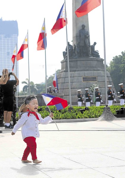 ON HIS OWN  A little boy wearing a Katipunero costume learns the meaning of independence as he is separated from his companions on Saturday during practice for participation in Independence Day ceremonies at Rizal Park today.  MARIANNE BERMUDEZ 