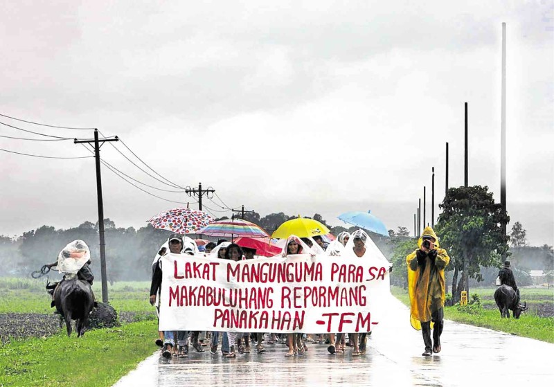 FARMERS from haciendas in the southern part of Negros Occidental march in Isabel town to call for a meaningful agrarian reform. Lyn Rillon